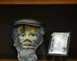 James 'Son' Thomas' sculpture of Delta blues guitarist and singer Sam Chatmon is on display at the University of Mississippi's J.D. Williams Library. Thomas, a Delta blues singer, is also known as a folk artist for his sculptures made from unfired clay. UM photo by Nathan Latil.