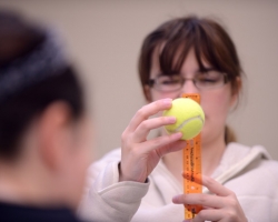 Tiffany Torma measures a tennis ball to calculate volume during the team activity portion of the 2013 Engineering Day Competition.  Photo by Nathan Latil/Ole Miss Communications