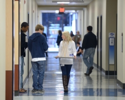 A Ridgeland High school student takes her team's entry to the judging room for the water tower competition at the 2013 Engineering Day on campus.  Photo by Nathan Latil/Ole Miss Communications