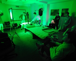 William A. Christens-Barry (left), chief scientist with Equipoise Imaging, aims an LED light array so the light passes through the center of the corresponding diffusion panel and onto the camera platform. Roger L. Easton Jr., professor at the Center for Imaging Science at the Rochester Institute of Technology, and University of Mississippi professor Gregory Heyworth assist with the alignment as Ole Miss students Kristen Vise (at computer) Andrew Henning and Mitchell Hobbs watch from the other end of the table. Observing the setup are John Hessler (left, behind computer) and Chet Van Duzer of the Library of Congress. UM photo by Robert Jordan.