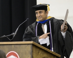 Upon receiving a Teacher of the Year award from the UM School of Pharmacy's 2012 Bachelor of Science graduates at commencement, Soumyajit Majumdar, associate professor of pharmaceutics, tells the crowd what the award means to him. UM photo by Nathan Latil.