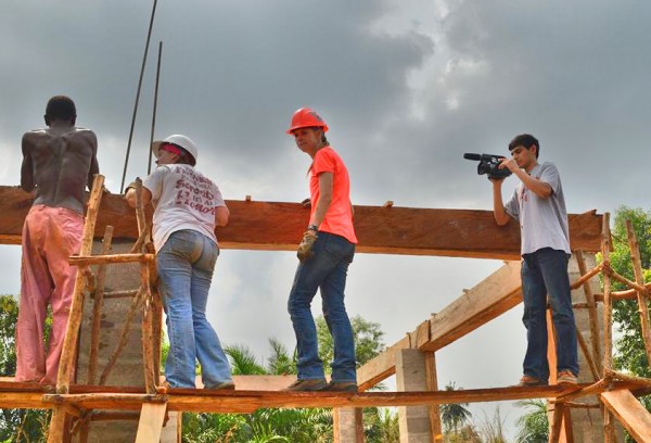 University of Mississippi Office of Communications student intern Sudu Upadhyay, right, films Ole Miss Engineers Without Borders Workers in Hedome, Togo.
