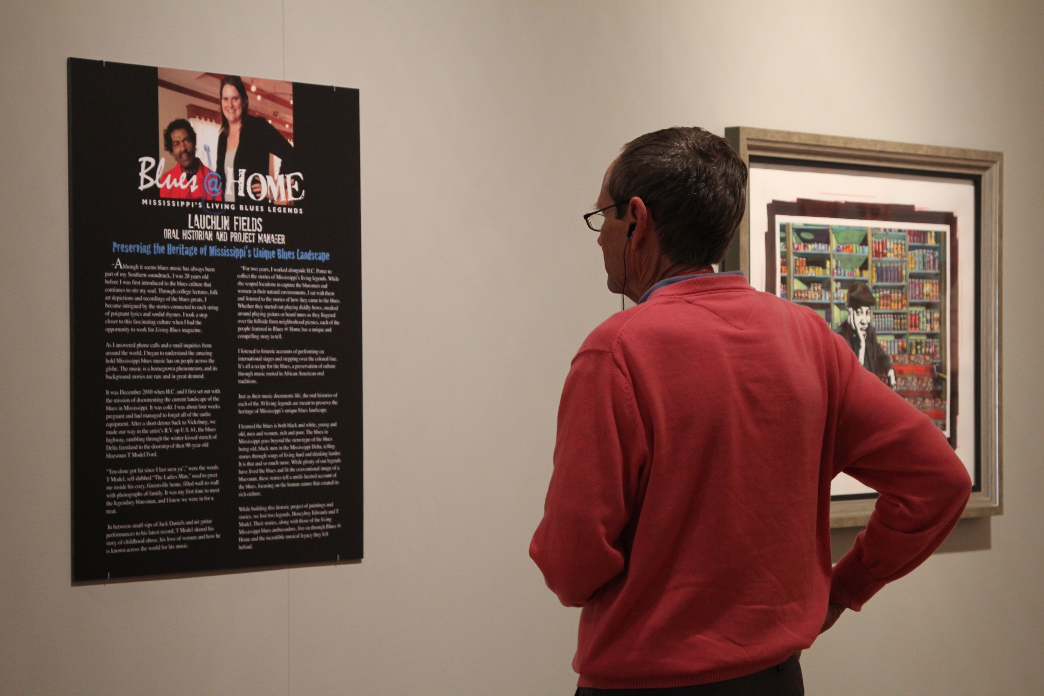 A University Museum visitor soaks in the sights and sounds of the Blues @ Home exhibit. H.C. Porter's work is on display through Aug. 2. 