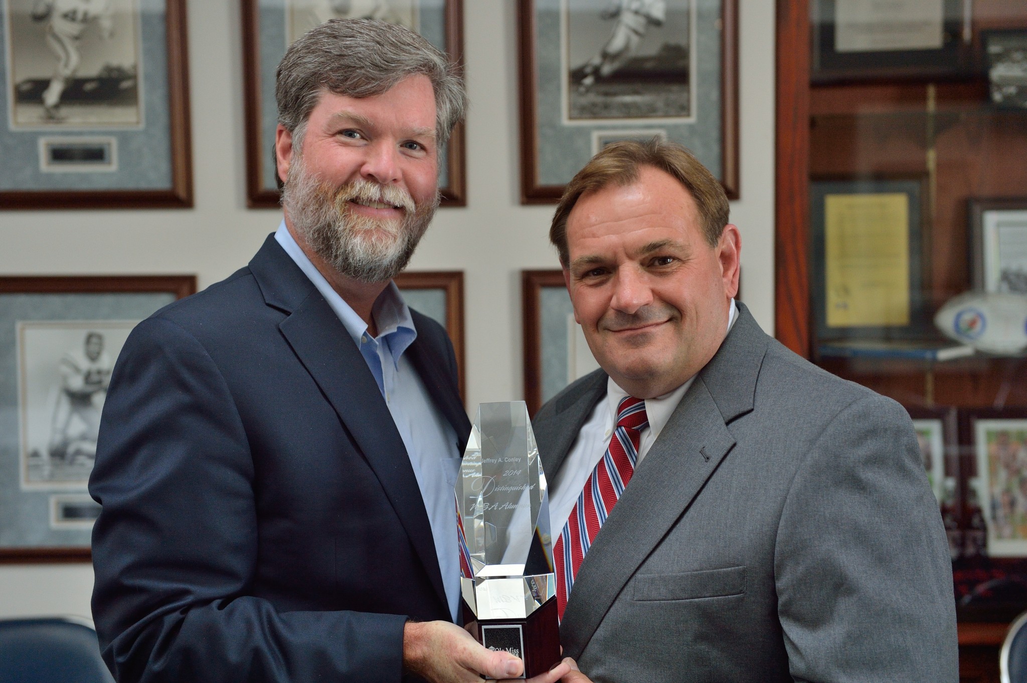 Dean Cyree (left) presents the award to Photo by Kevin Bain/Ole Miss Communications