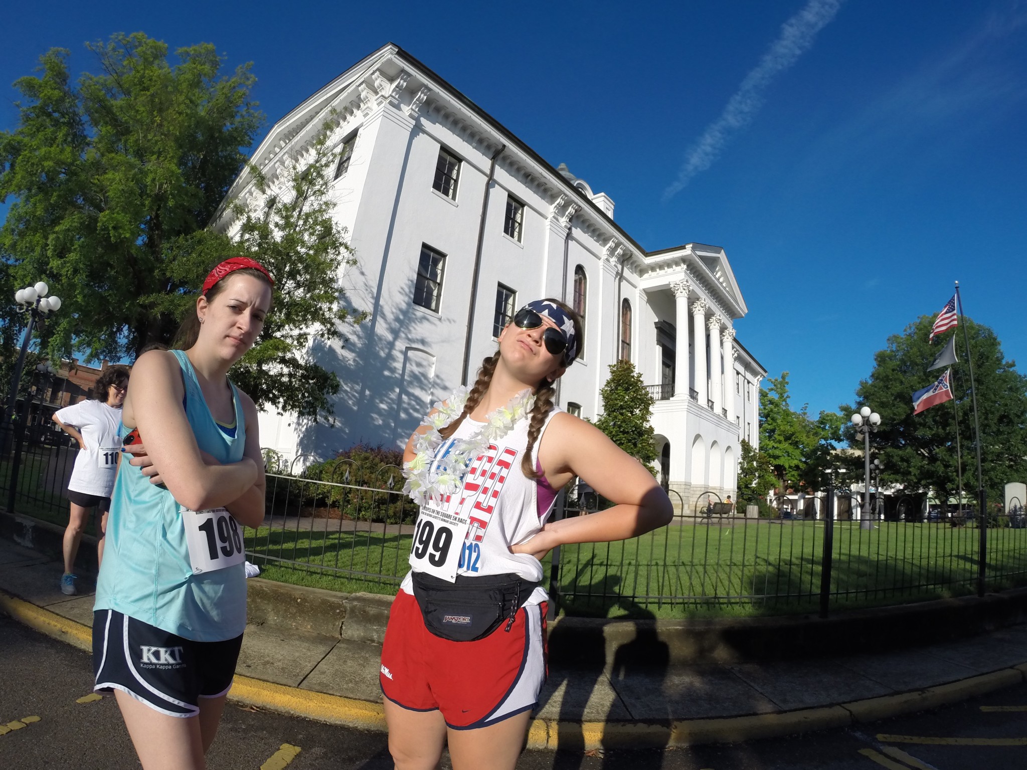 My sister, Claire Rearick (left), and my friend, Casey (right), flaunt their America-themed attire in a pre-race photo outside the Lafayette County Courthouse. 