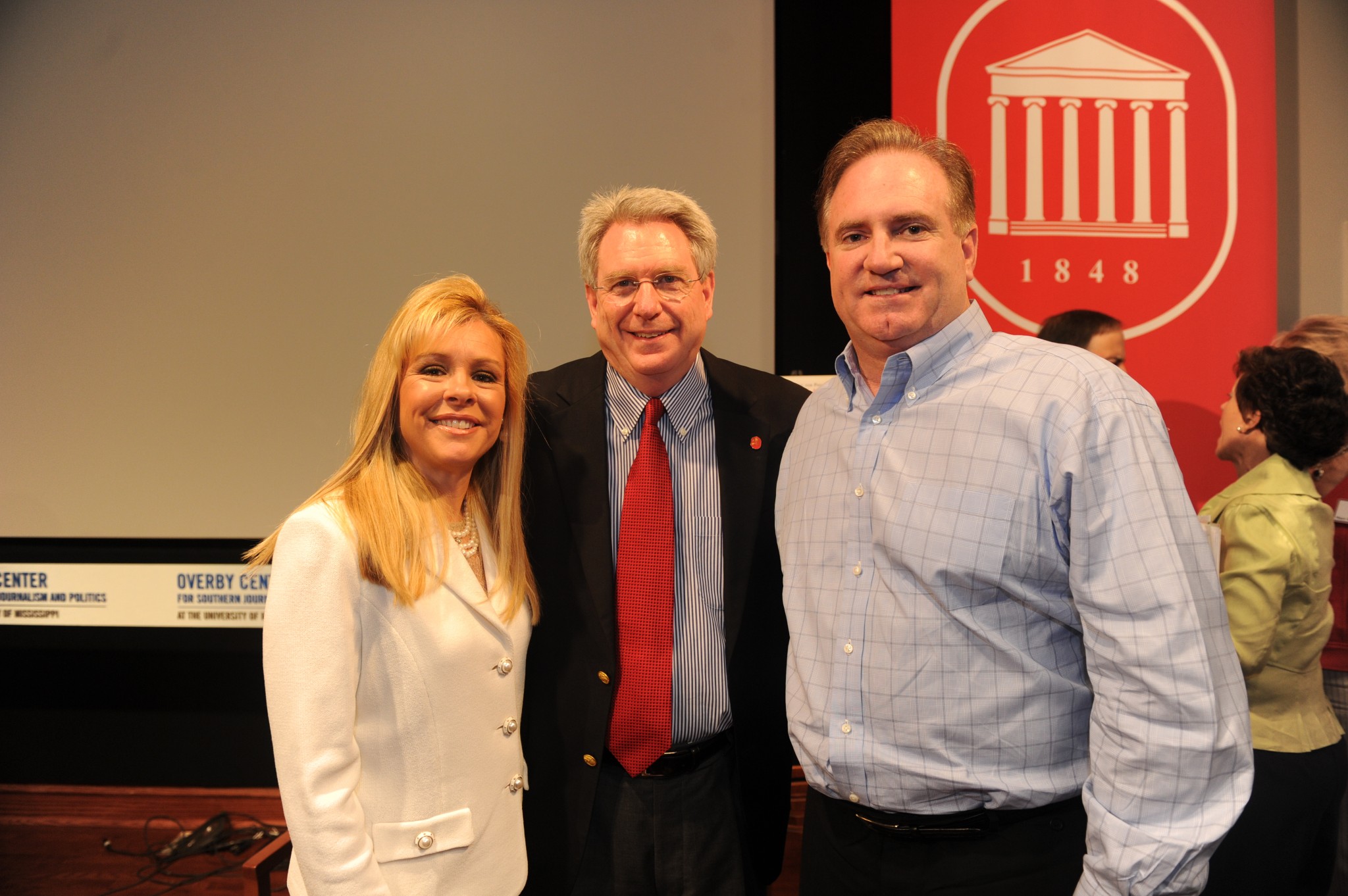 UM Chancellor Dan Jones with Lee Ann (left) and Sean  (right) Touhy. Photo by Nathan Latil, UM Brand Photography