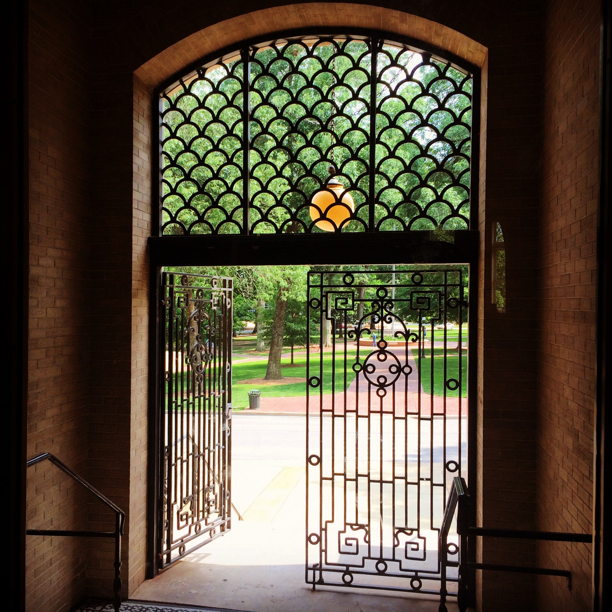 The fancy ironwork entrance to Bryant Hall faces the Lyceum Circle. Photo by Michael Newsom