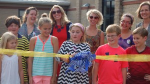 Della Davidson Elementary School student Molly Cat Tannehill, center, cuts the ribbon on the new student garden with students Stella Wilkins, Wes Carwile, Julia Dennis, Patrick Murphy and Walker Repka. Tannehill won the contest to name the garden "Food for Thought." She is joined by Good Food for Oxford Schools program director Sunny Young, projects coordinator Lauren Williams, Food Corps service member Mallory Stefan, Good Food voluteer Katelynn Dillard and Kathy Knight, associate professor in the Nutrition and Hospitality Management Department at the University of Mississippi.