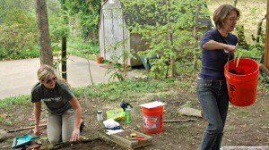 Stephanie Orsini, an anthropology graduate student from Libertyville, Illinois, left, works with UM Assistant Professor of Anthropology Carolyn Freiwald, right, beside the former slave quarters at the Hugh Craft House in Holly Springs.