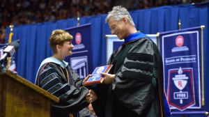 Dr. Brandi Hephner LaBanc presents Dr. Luca Bombelli with the Frist Student Service Award. Photo by Kevin Bain.