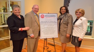 UM Chancellor Dan Jones (second from left), pictured with wife Lydia (left), receives a surprise announcement from UM Foundation Board Chair Rose Flenorl (second from right) and board member Suzan Thames that an endowed chair for faculty support worth $1.5 million in his name is being raised by UM alumni, friends, faculty and staff as thanks for Jones' numerous efforts to prioritize faculty support during his tenure.