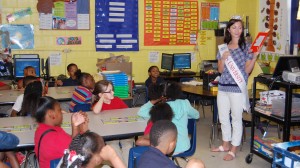 Miss University France Beard reads to a second grade class at Quitman Elementary School.