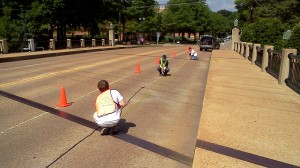 Civil engineering graduate students take vibration measurements on Ford Center Bridge.