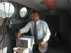 UM civil engineering professor Waheed Uddin checks data using his ground penetrating radar system.