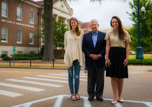 Ed Meek greets 2015 Bill and Jean May Mississippi Sun scholars HartLee Gabbert (left) and Lyndy Berryhill in front of the UM Meek School of Journalism and New Media. The scholarship honors longtime friends of Ed and Becky Meek.
