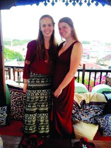 Gracie Snyder (left) and Crissandra George attend a rooftop dinner in Zanzibar, an archipelago off the east coast of Tanzania, where the group learned about Tarab traditions, which are a mix of Arabic and Swahili cultures. Snyder and George were among 12 UM students who visited East Africa this summer as part of a study abroad course. Photo courtesy Crissandra George