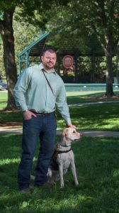 UM graduate student Ben Stepp and service dog Arliegh have attended every class together since 2014. Photo by Robert Jordan/Ole Miss Communications