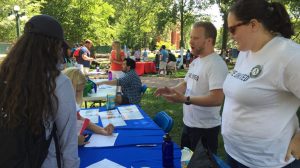 North Mississippi VISTAs Liam Clements and Chelsea Herbert (right) work the United Way booth in the Grove at the University of Mississippi. Submitted photo