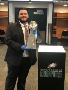 Jonathan Hvozdovic, a senior sport and recreation management major at the University of Mississippi, displays the Philadelphia Eagles’ 2018 Super Bowl trophy during his internship with this Major League Baseball team's Fan Services division. Submitted photo