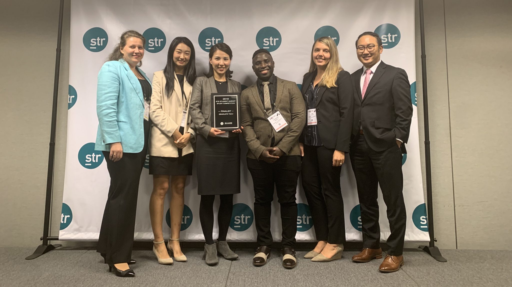 Cindy Choi, assistant professor of nutrition and hospitality management, congratulates hospitality management doctoral students (left to right) Olena Ciftci of Ukraine, Hayeon Choi of South Korea, Thamsie Jongile of South Africa, Inna Soifer of Russia, and Jangwoo Jo of South Korea for being recognized as finalists in the STR Student Market Study Competition in New York this November. Submitted photo